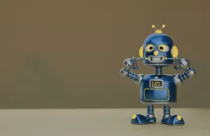 Yellow-accent robot grinning with a GUESS display.